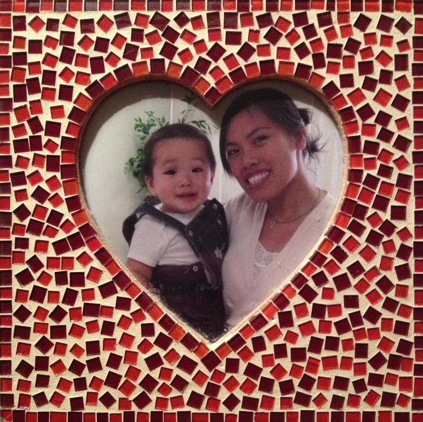 Diana holding Eitan - mother and son